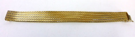 A gold plated metal articulated bracelet