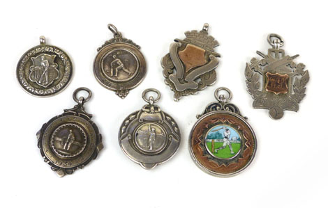 Of Cricketing interest: A group of seven early 20th century silver medallions including one