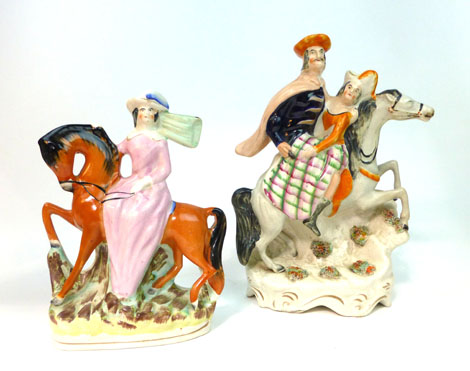 A Staffordshire equestrian figural group modelled as a male figure seated on a horse and carrying