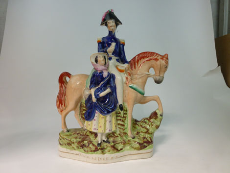 A Staffordshire equestrian figural group titled 'Vivandiere', h. 33.5 cm    CONDITION REPORT: