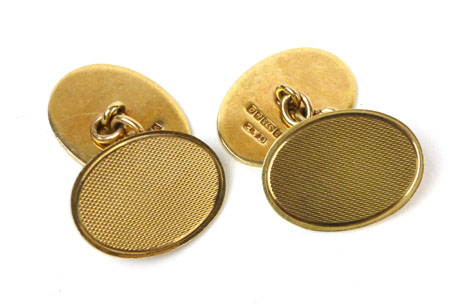 A pair of 9ct yellow gold engine turned oval cufflinks, approx. 6.5 gms