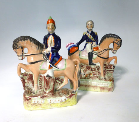 A pair of Staffordshire equestrian figures titled 'The Sultan' and 'Marshall Arnaud', max h. 22 cm(
