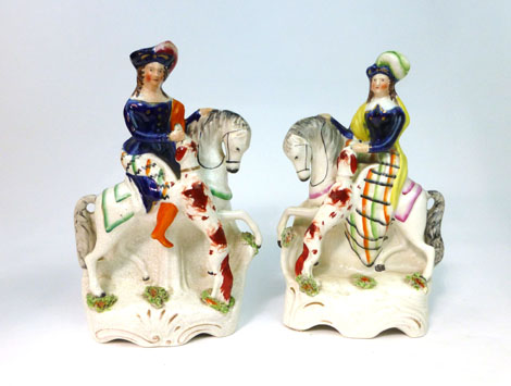 A pair of Staffordshire equestrian figures, each modelled as a Royal princess, seated on a horse and