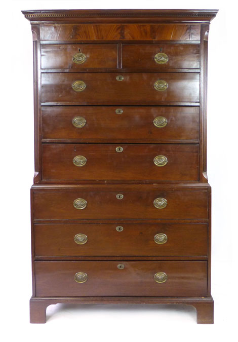 A George III mahogany chest on chest with dentil cornice over two graduated long and six short