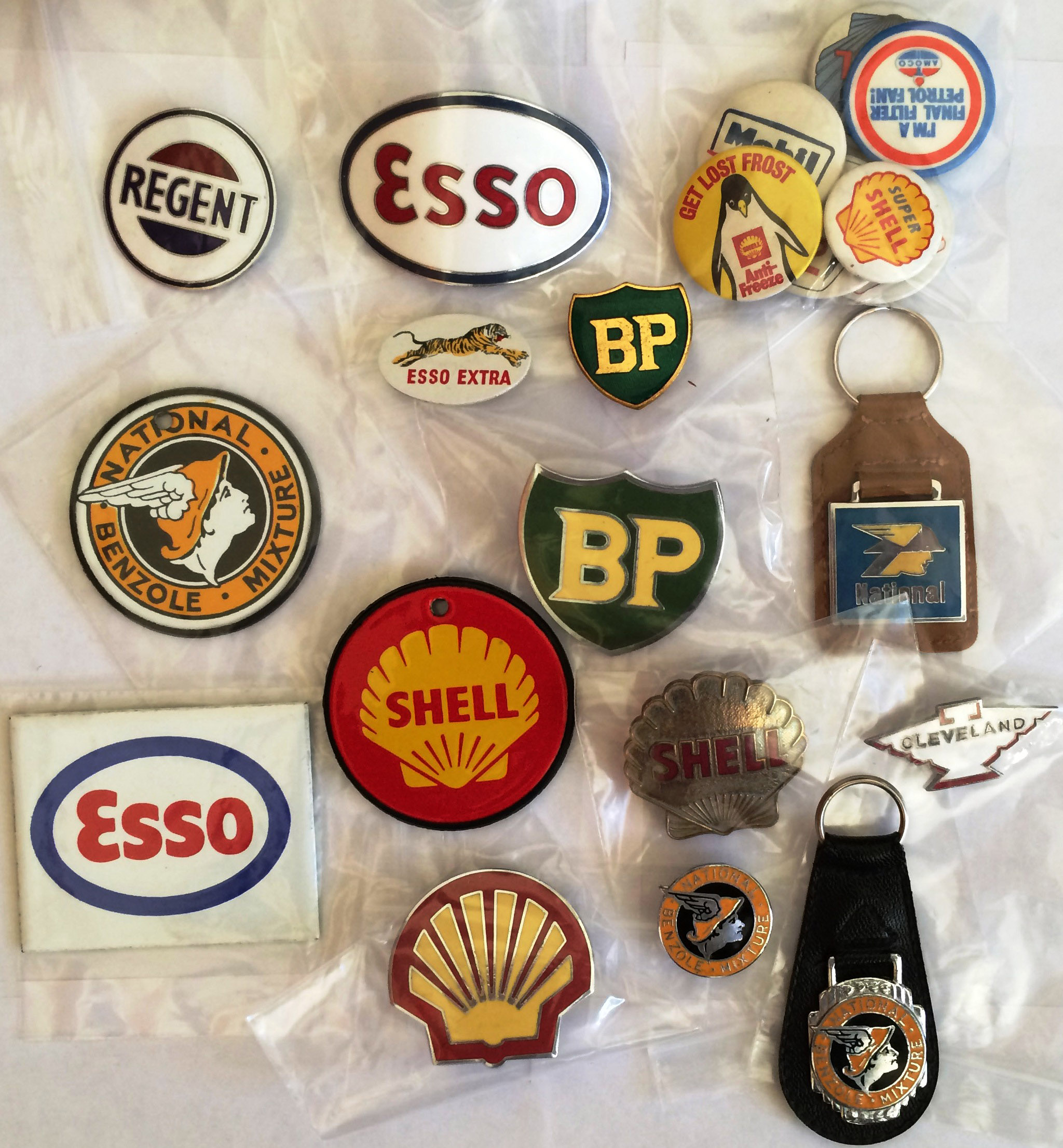 Collection of petrol company BADGES & KEY FOBS including most traditional names. Considerable