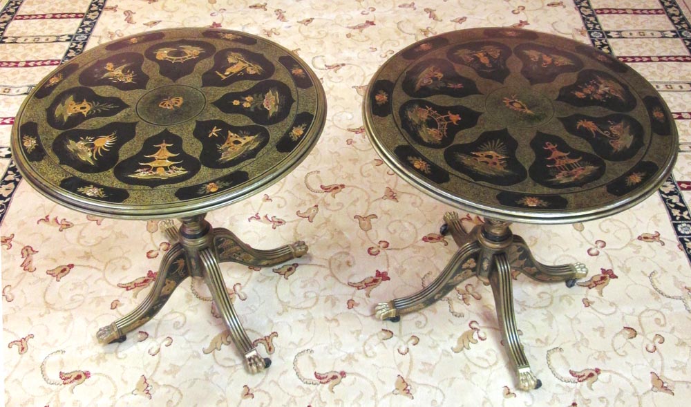 LOW TABLES, a pair, black and gilt chinoiserie decorated with circular tops, 53cm H x 52cm D. (2)