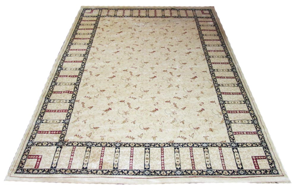 NORTHERN INDIAN DESIGN CARPET, 330cm x 210cm, ivory field of scrolling vines within corresponding