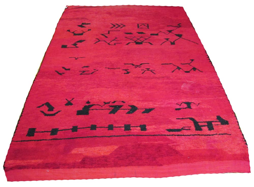 VINTAGE MOROCCAN BERBER CARPET, 306cm x 203cm, with noir motifs on ruby field.