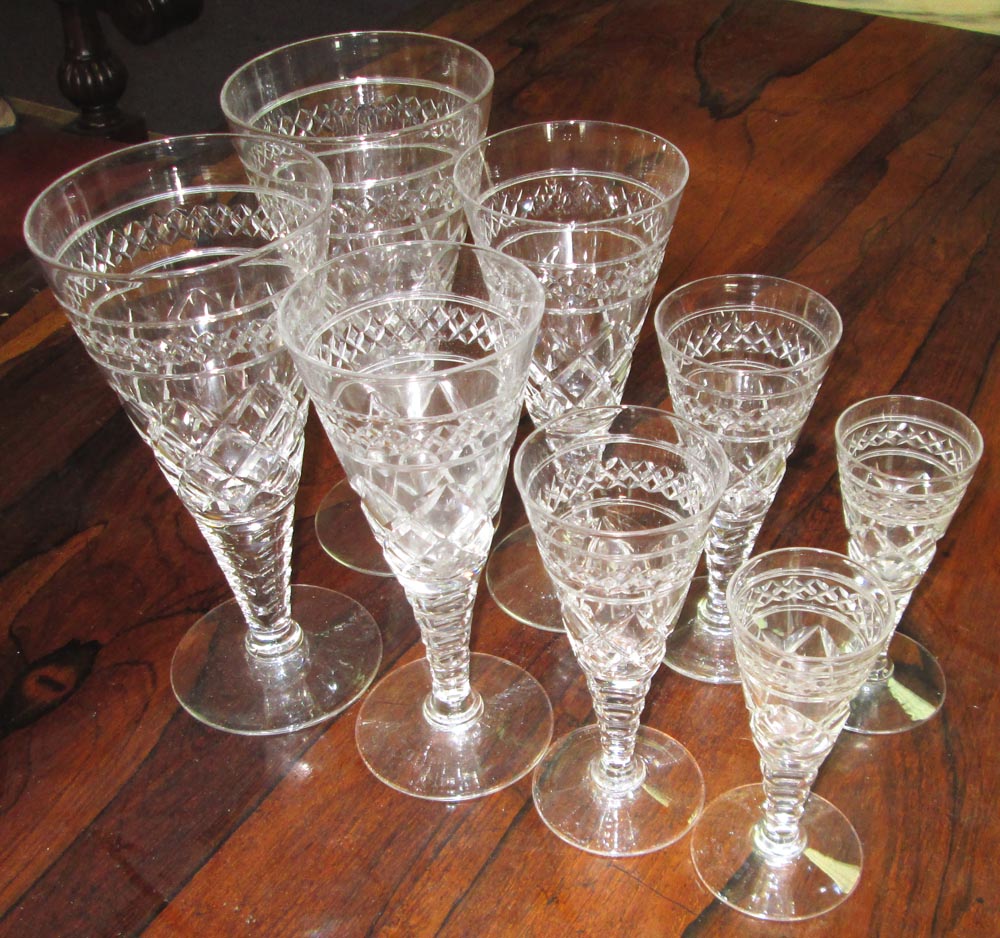 WINE GLASSES, twenty nine of various sizes all with conical, diamond cut bowls, tallest 19cm H. (