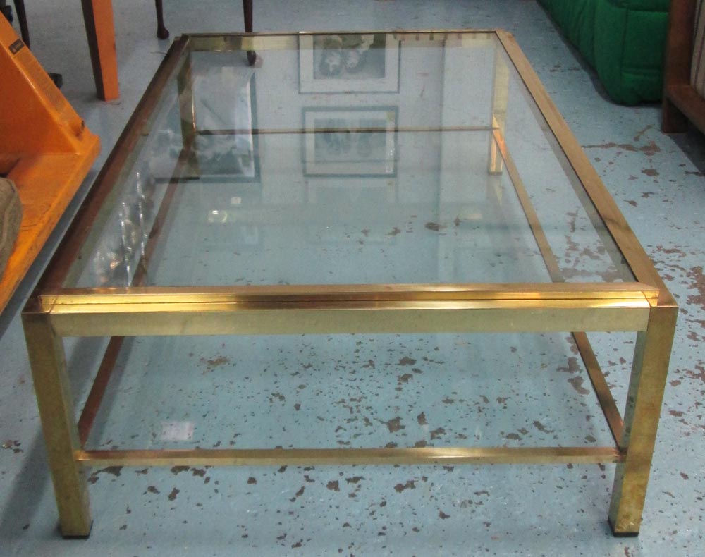 LOW TABLE, brass framed with a rectangular glass top and undertier, 130cm x 39cm H x 80cm.