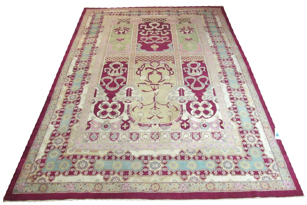 VERY FINE AMRITSAR CARPET, 395cm x 270cm, mihrab design in ivory cerise and jade within rosetted