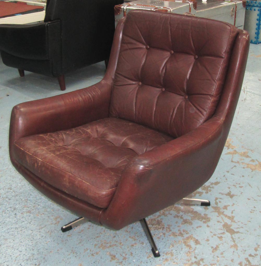 SWIVEL ARMCHAIR, 1970s, buttoned brown leather on chrome supports, 70cm x 69cm D x 75cm H. (with