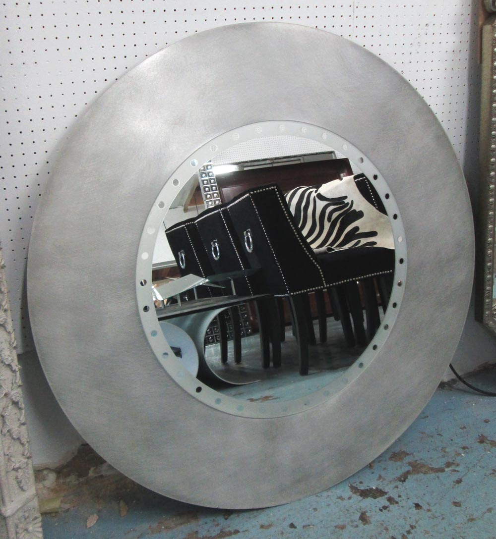 MIRROR, circular, from Heals in a stainless steel surround, 97cm diam.