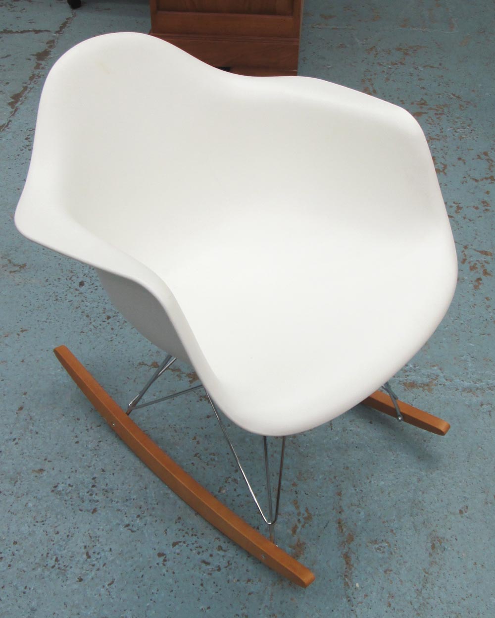 ROCKER, contemporary style in white on steel struts and wooden skates, 62cm W.