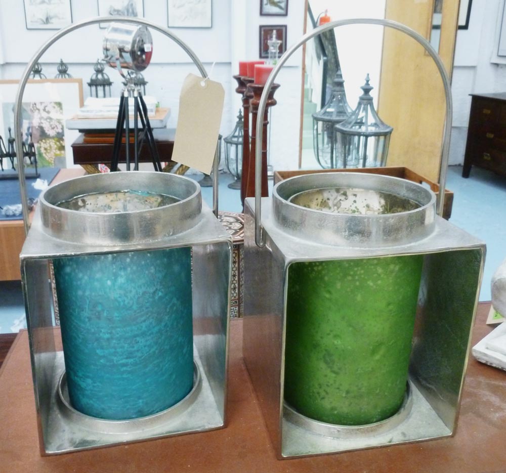 STORM LANTERNS, a pair, green and blue glass, 58cm H x 25cm x 25cm. (2)