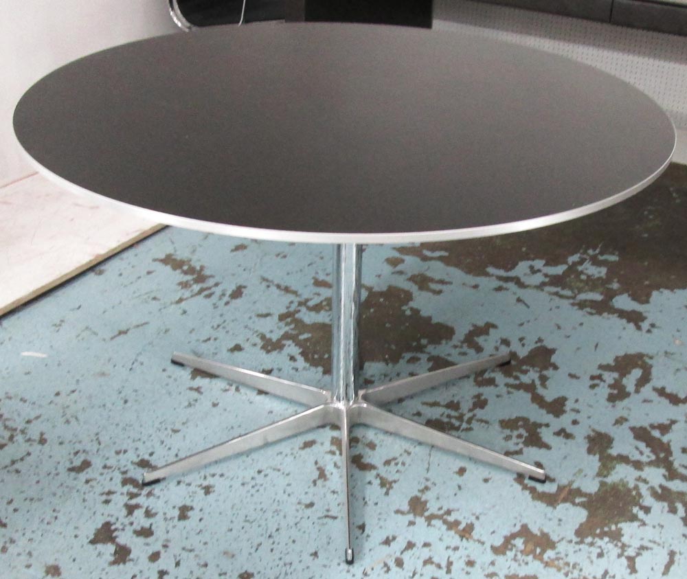 REPUBLIC OF FRITZ HANSEN DINING TABLE, circular, in black on chromed metal central supports, label