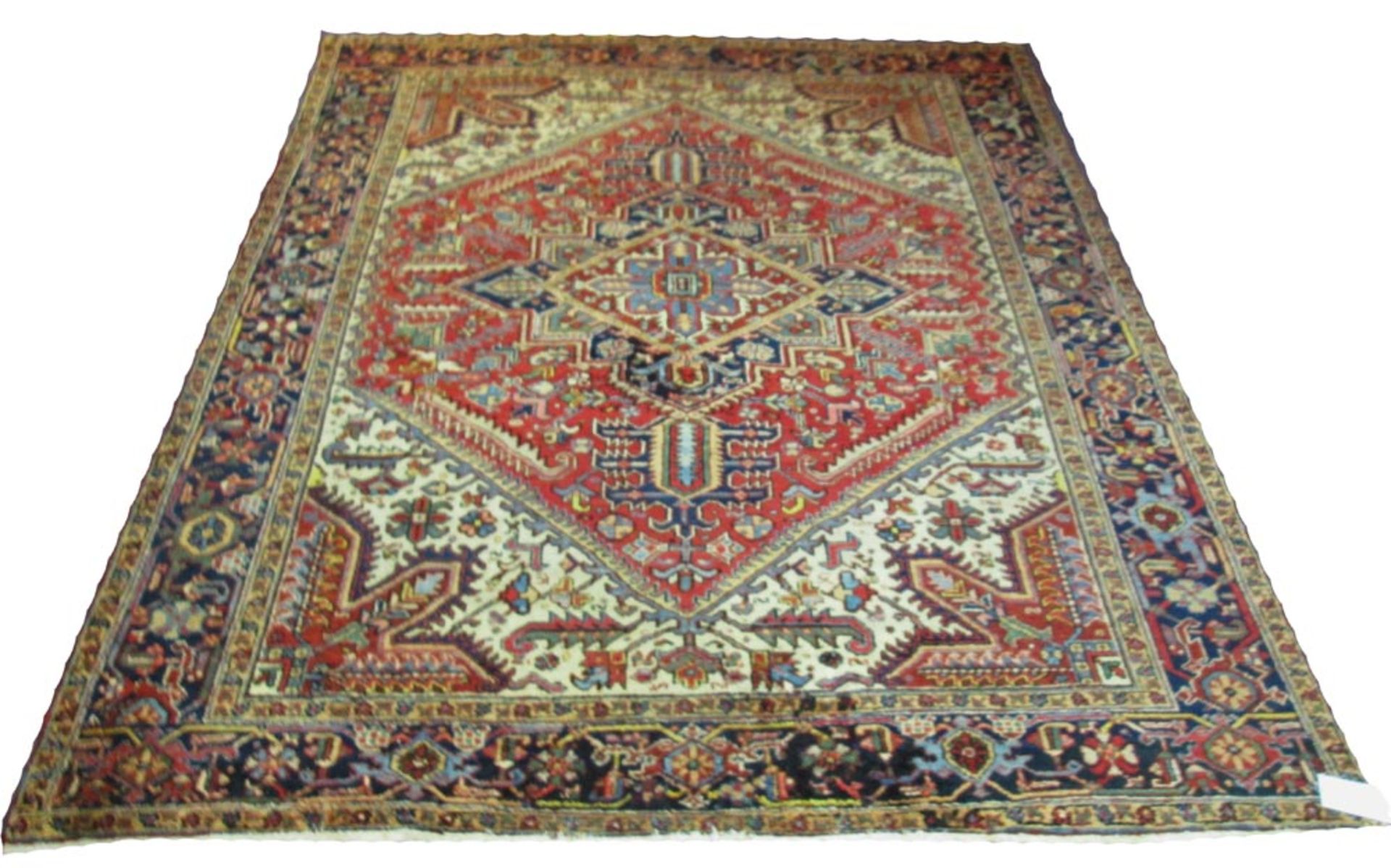 ANTIQUE HERIZ CARPET, 304cm x 250cm, medallion issuing palmettes on ruby field of vines and leaves.