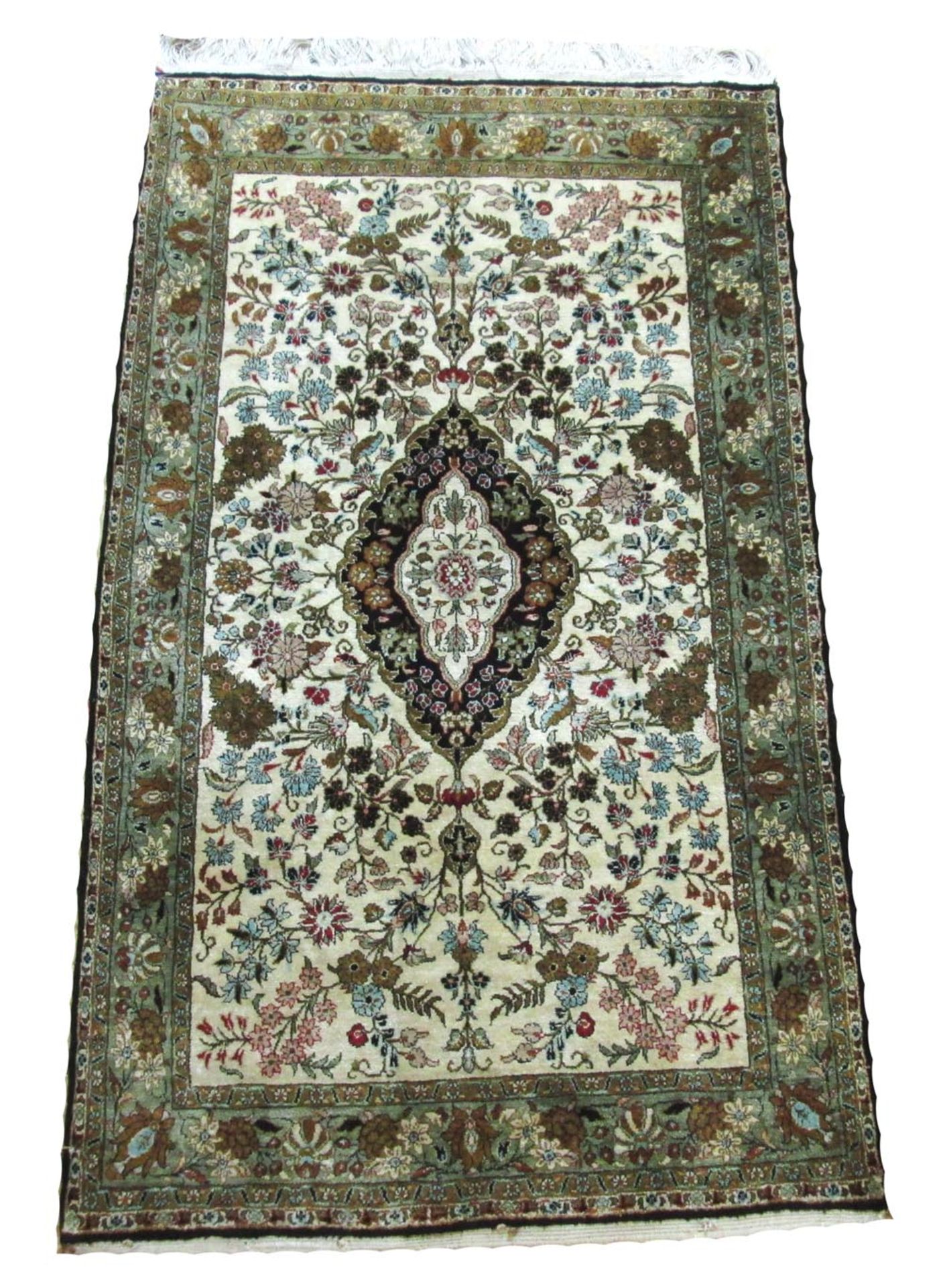 SILK KASHAN RUG, 128cm x 76cm, ivory rosetted medallion on ruby field of stylised palmettes.