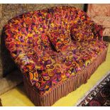 SOFA, with a buttoned back and psychedelic, paisley patterned velvet upholstery having three scatter