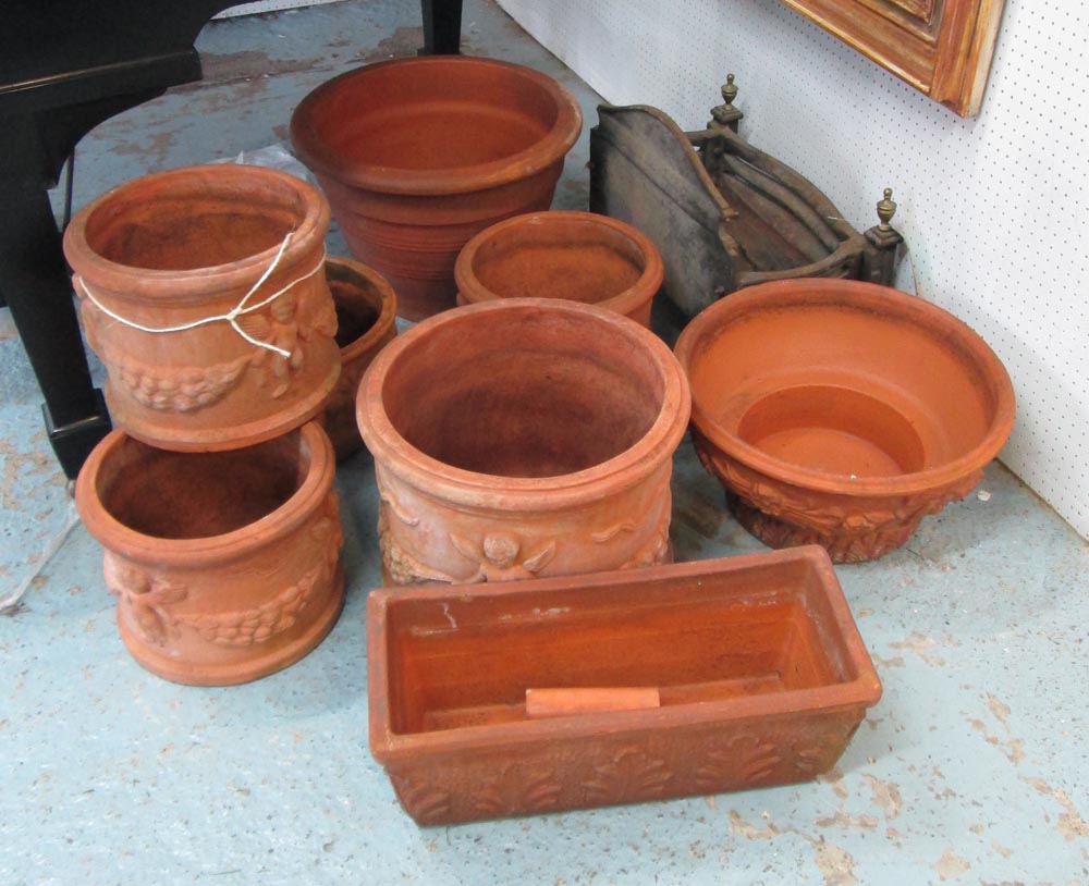 TERRACOTTA PLANTERS, eight, seven circular, one rectangular, four with decorative swag and angel