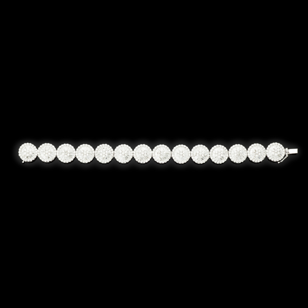 A contemporary diamond braceletcomposed of fourteen circular clusters, each set in white metal with - Image 2 of 2