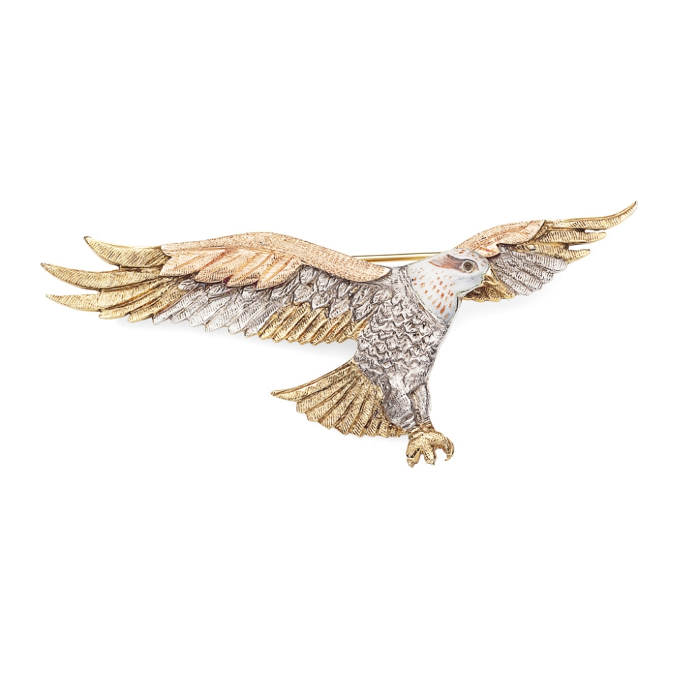A multi-coloured 9ct gold and enamel novelty broochmodelled as an eagle in flight in 9ct yellow,