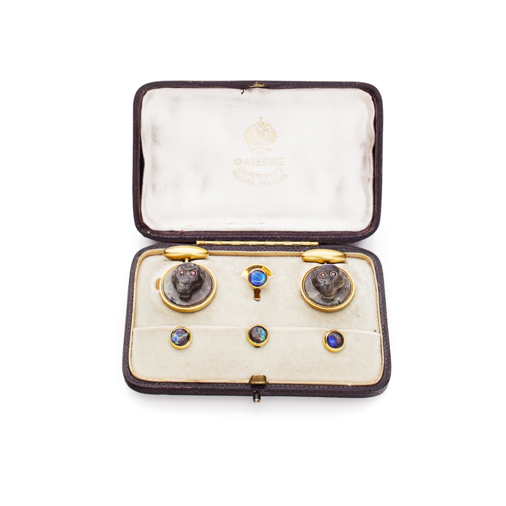 A cased set of Russian labradorite cufflinksthe circular terminals with well carved monkey`s head,