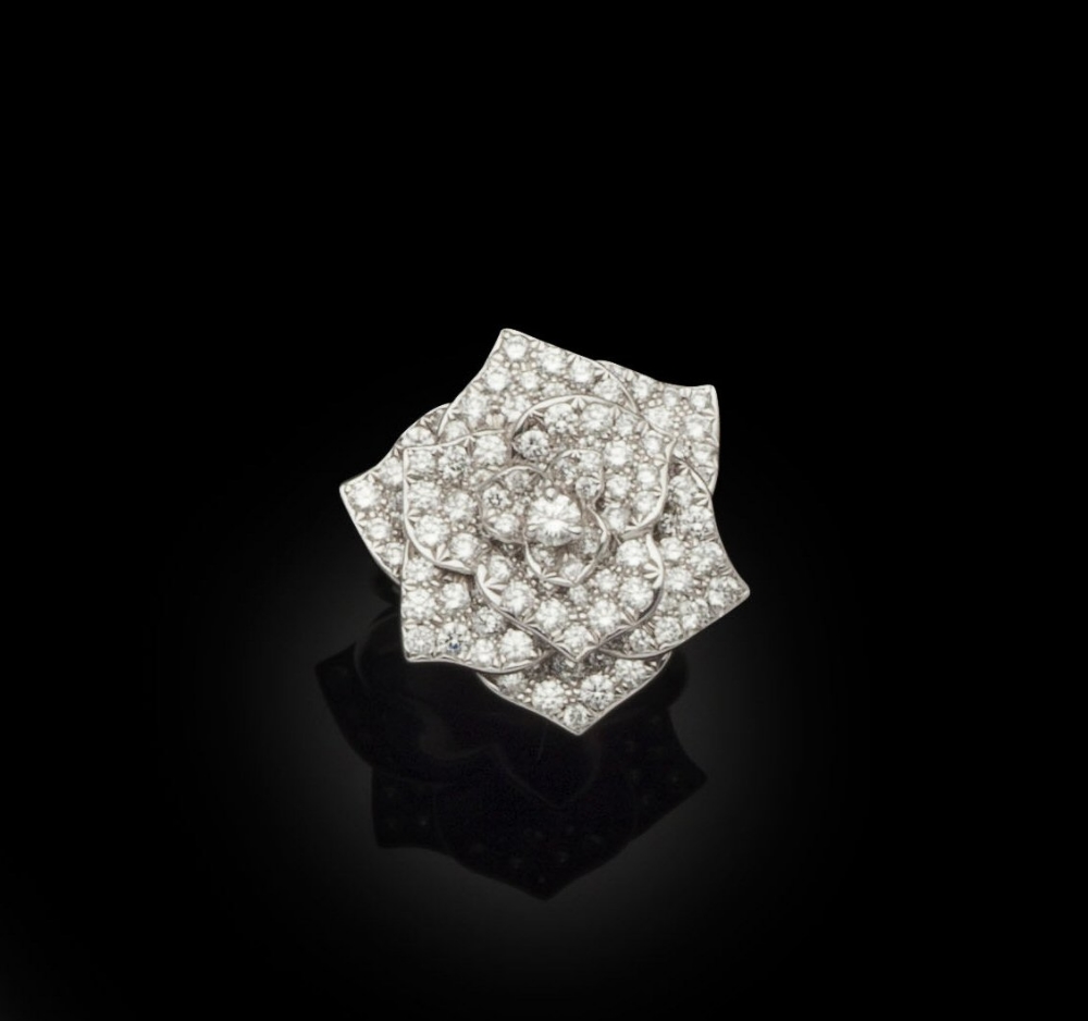 PIAGET - A diamond set rose ringmodelled as a rose in 18ct white gold, each petal pave set