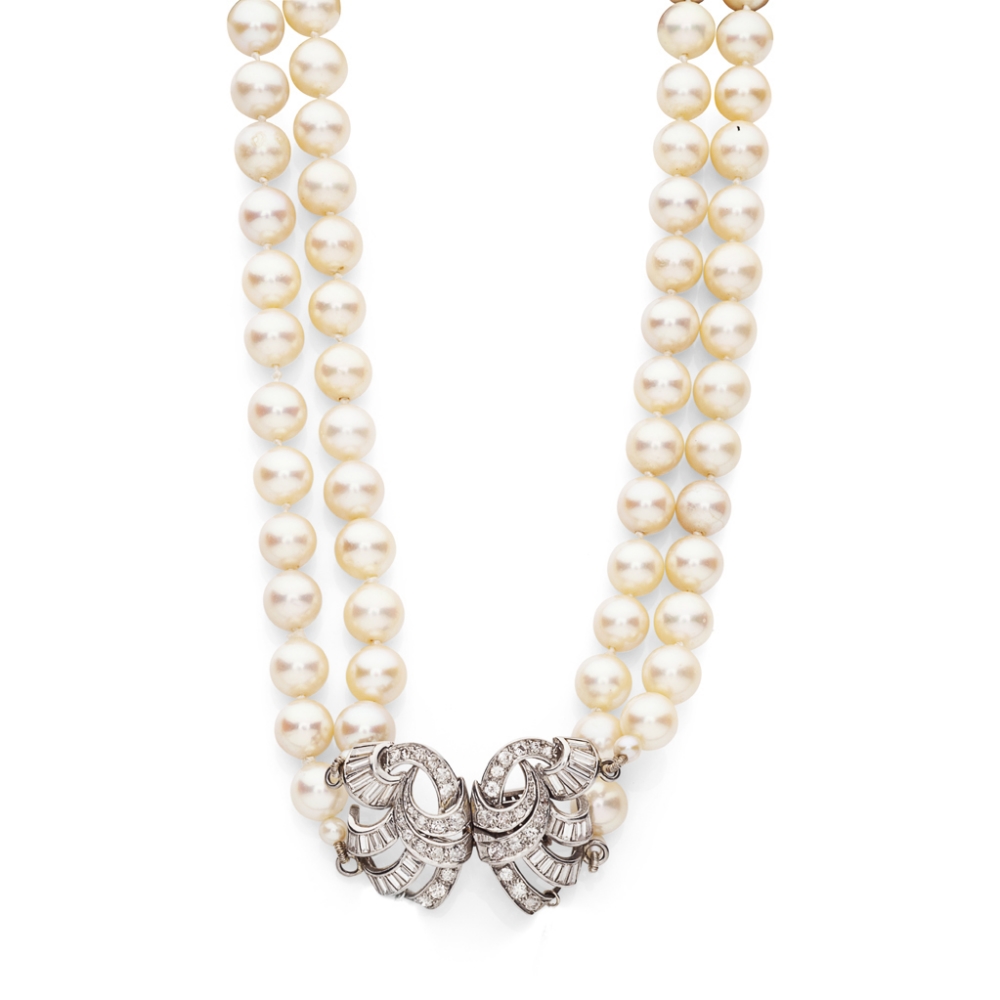 A two-row cultured pearl necklace with diamond claspcomposed of ninety-two uniform pearls and four