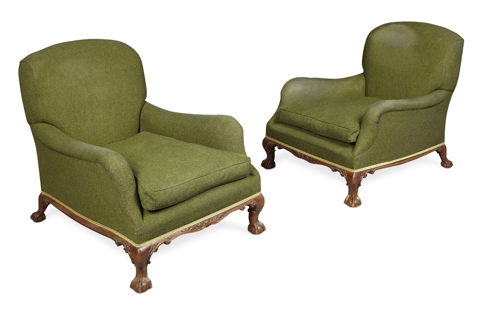 PAIR OF HOWARD & SONS EASY ARMCHAIRSLATE 19TH CENTURYwith the deep seats and padded roll arms,