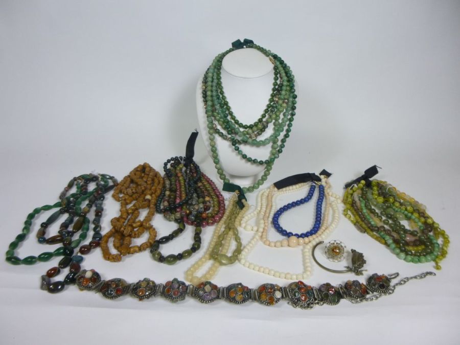 GROUP OF HARDSTONE JEWELLERYcomprising of: several necklaces of hardstone beads; a string of carved