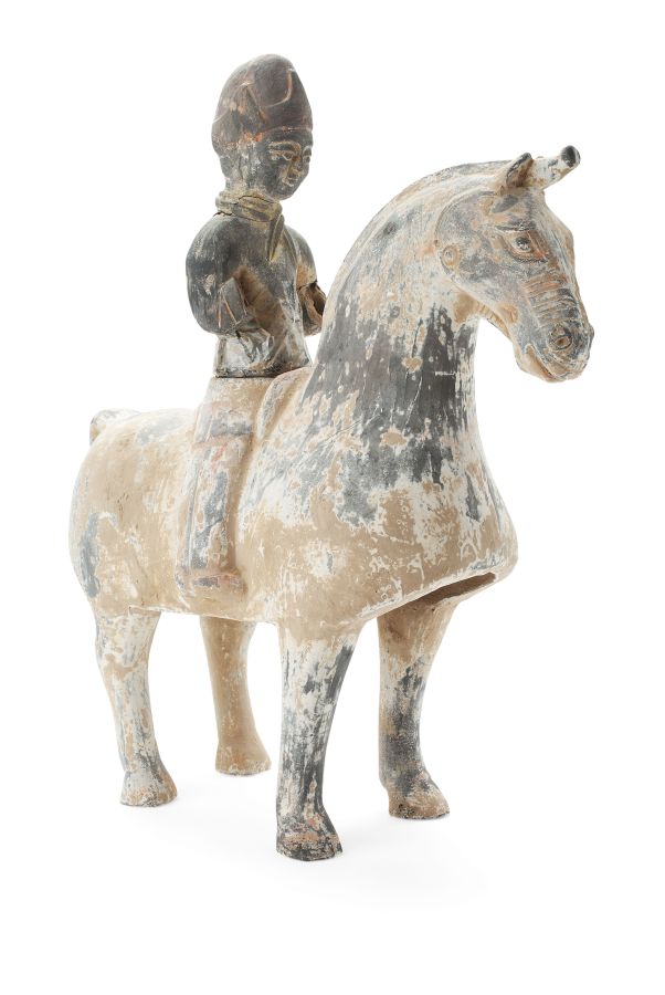 CHINESE POTTERY HORSE AND RIDERPROBABLY TANG DYNASTYtraces of old paint, the rider sitting firmly