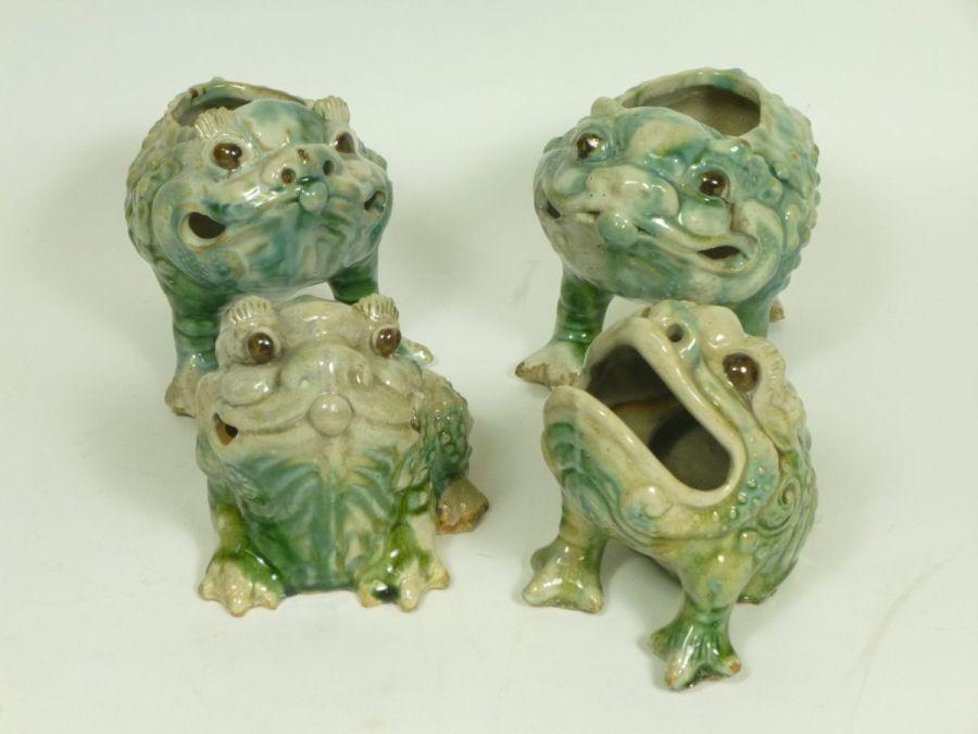 GROUP OF THREE LEGGED POTTERY TOADScomprising of four examples, two standing with openings to their