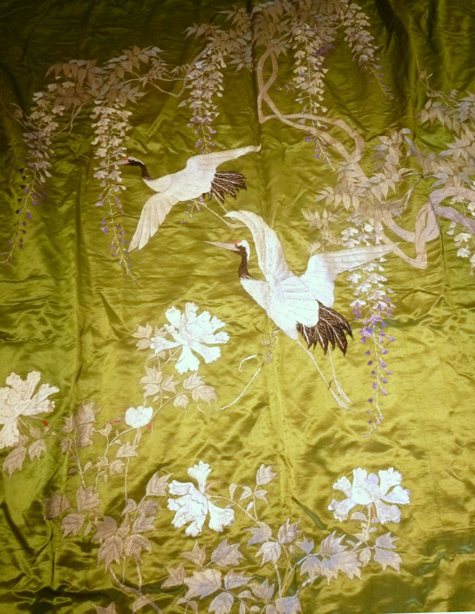 CHINESE EMBROIDERED SILK PANELof square form, the green silk decorated with cranes and peonies