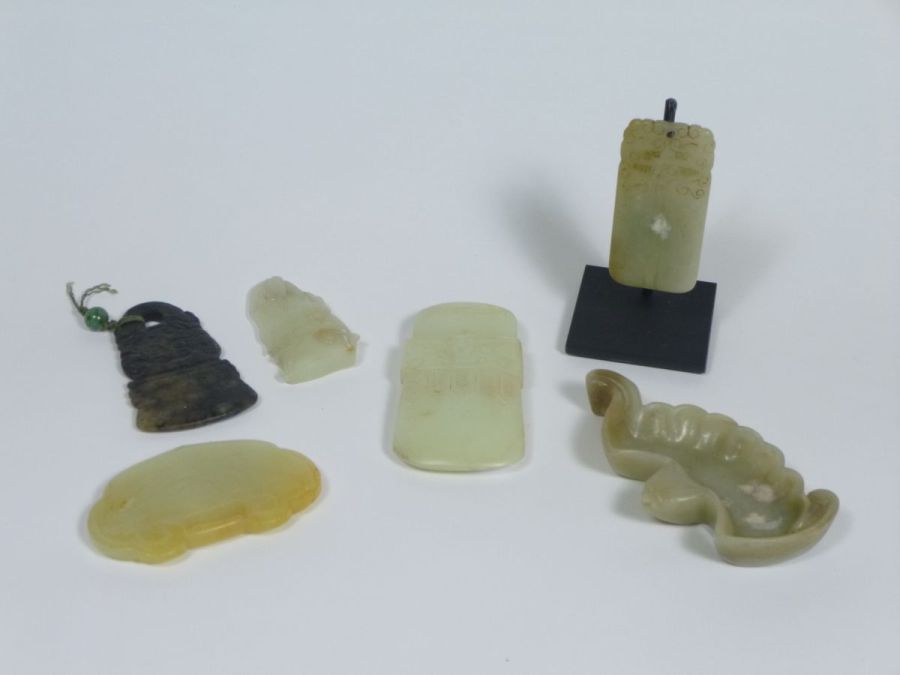 GROUP OF SIX JADE CARVINGScomprising: a pale celadon jade bamboo stem among lingzhi fungus; a