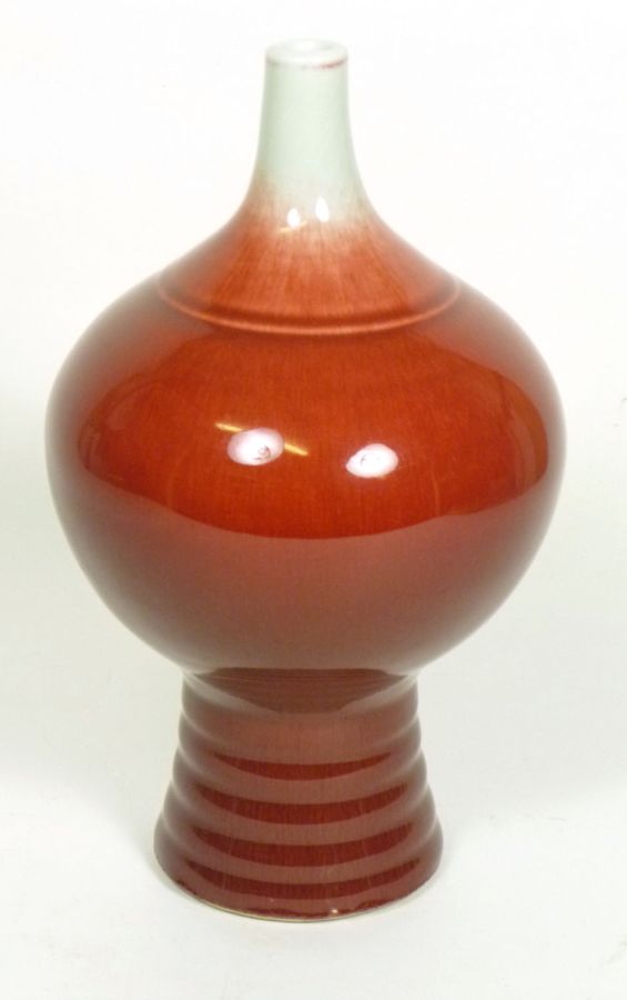 CHINESE FLAMBE GLAZED VASEthe ovoid body tapering to a thin neck, all raised on a ribbed foot, with