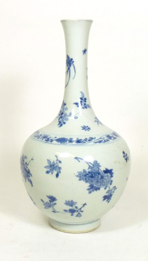 JAPANESE BLUE AND WHITE BOTTLE VASEEDO PERIODthe flared neck and ovoid sides painted in underglaze