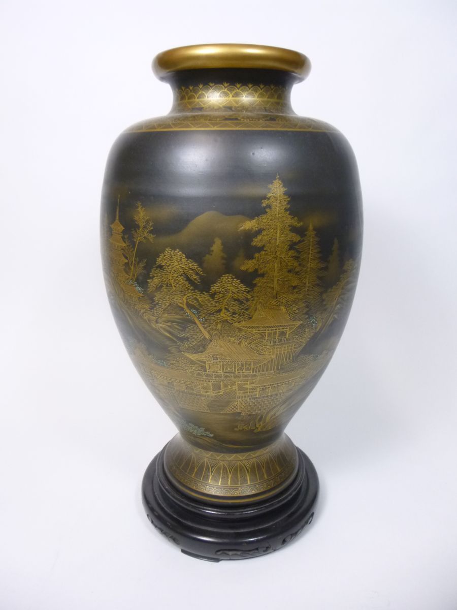 JAPANESE SATSUMA VASEof baluster form with an everted rim, decorated with gilt buildings in a