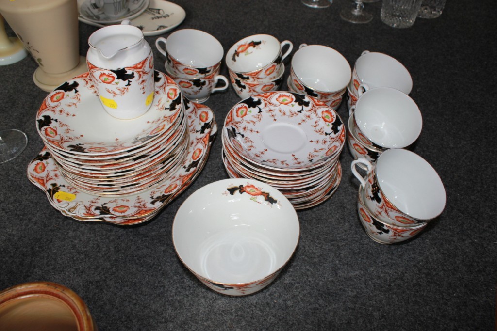 A `Tuscan` china tea service, comprising of twelve cups, twelve saucers, twelve plates, two