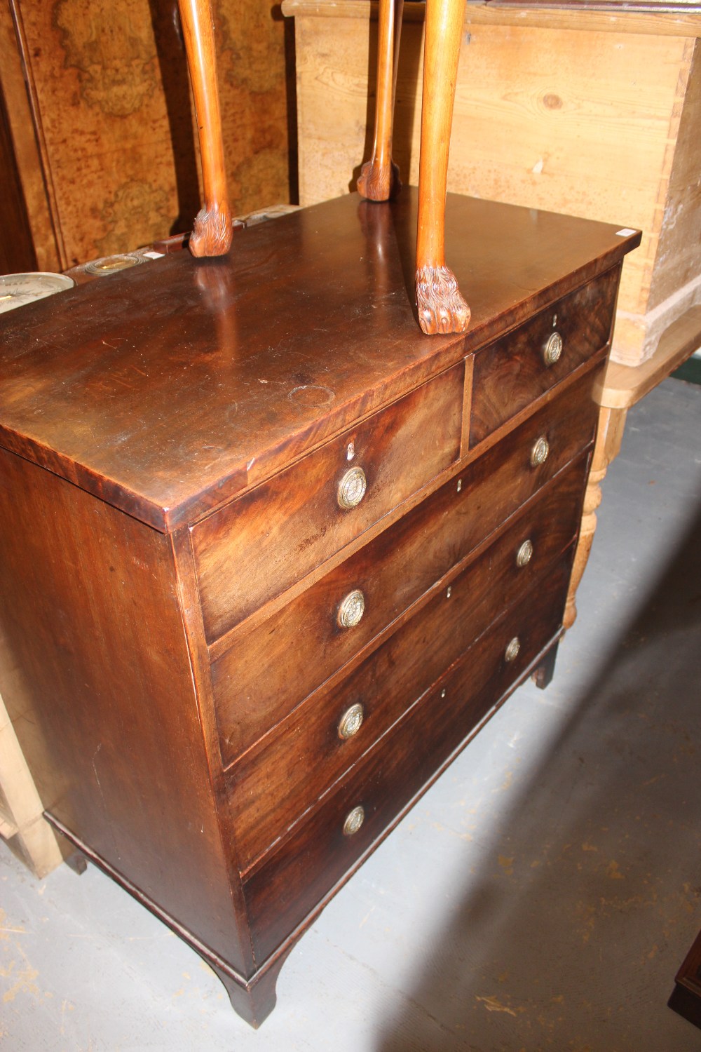 AN EARLY VICTORIAN MAHOGANY CHEST of two short and three long drawers, each with brass ring handles