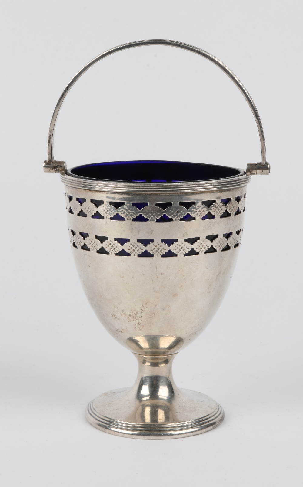 AN EARLY 20TH CENTURY SILVER OR BON BON BASKET with reeded looped handle and pierced decoration,