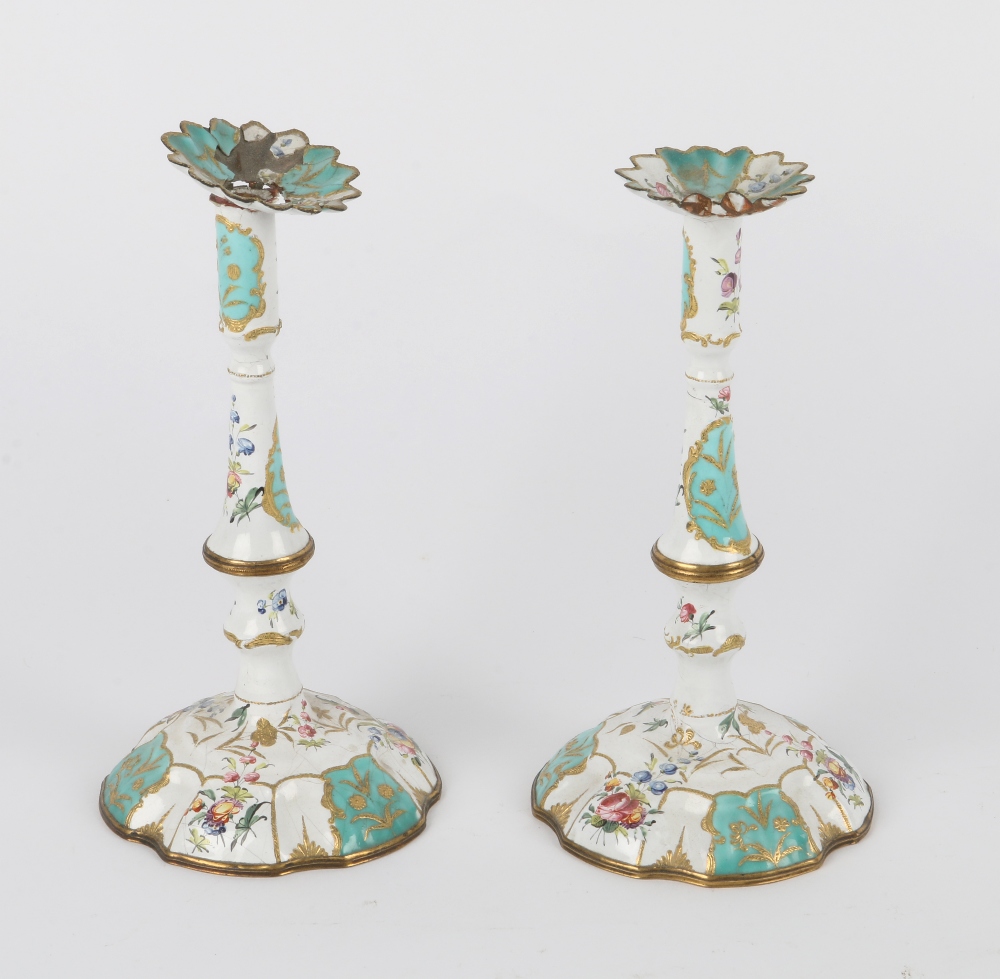 A PAIR OF GEORGE III BATTERSEA ENAMEL TAPER STICKS with coloured enamel sprays of flowers and