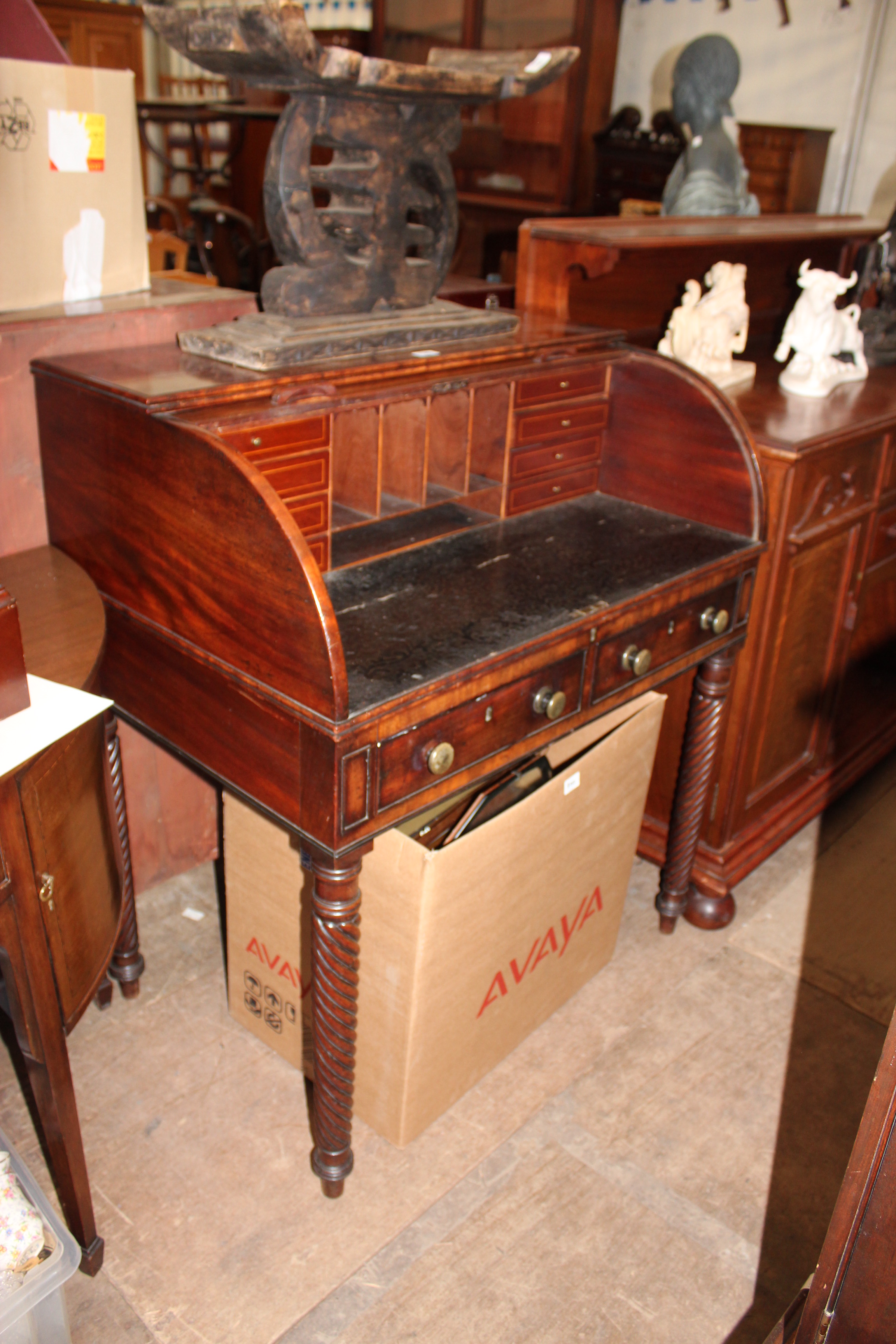 A GEORGE IV MAHOGANY WRITING DESK with tambour fall front, two drawers and spiral turned legs, 93cm
