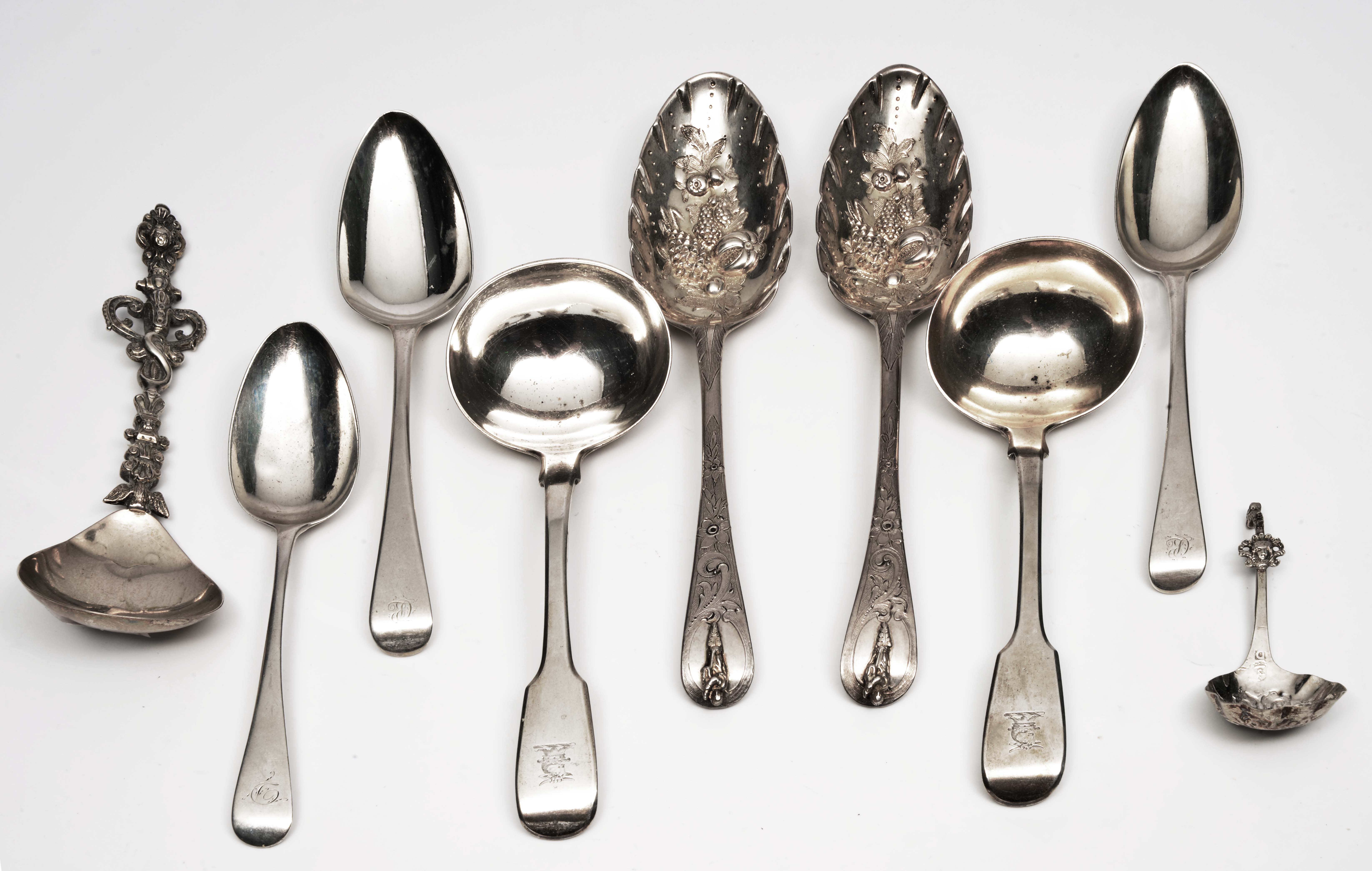 TWO 18TH CENTURY SILVER BERRY SPOONS, two silver sauce ladels, three Georgian dessert spoons, a