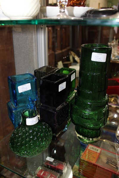 FOUR COLOURED GLASS VASES AFTER THE WHITEFRIARS DRUNKEN BRICK LAYER DESIGN each approx 25.5cm tall