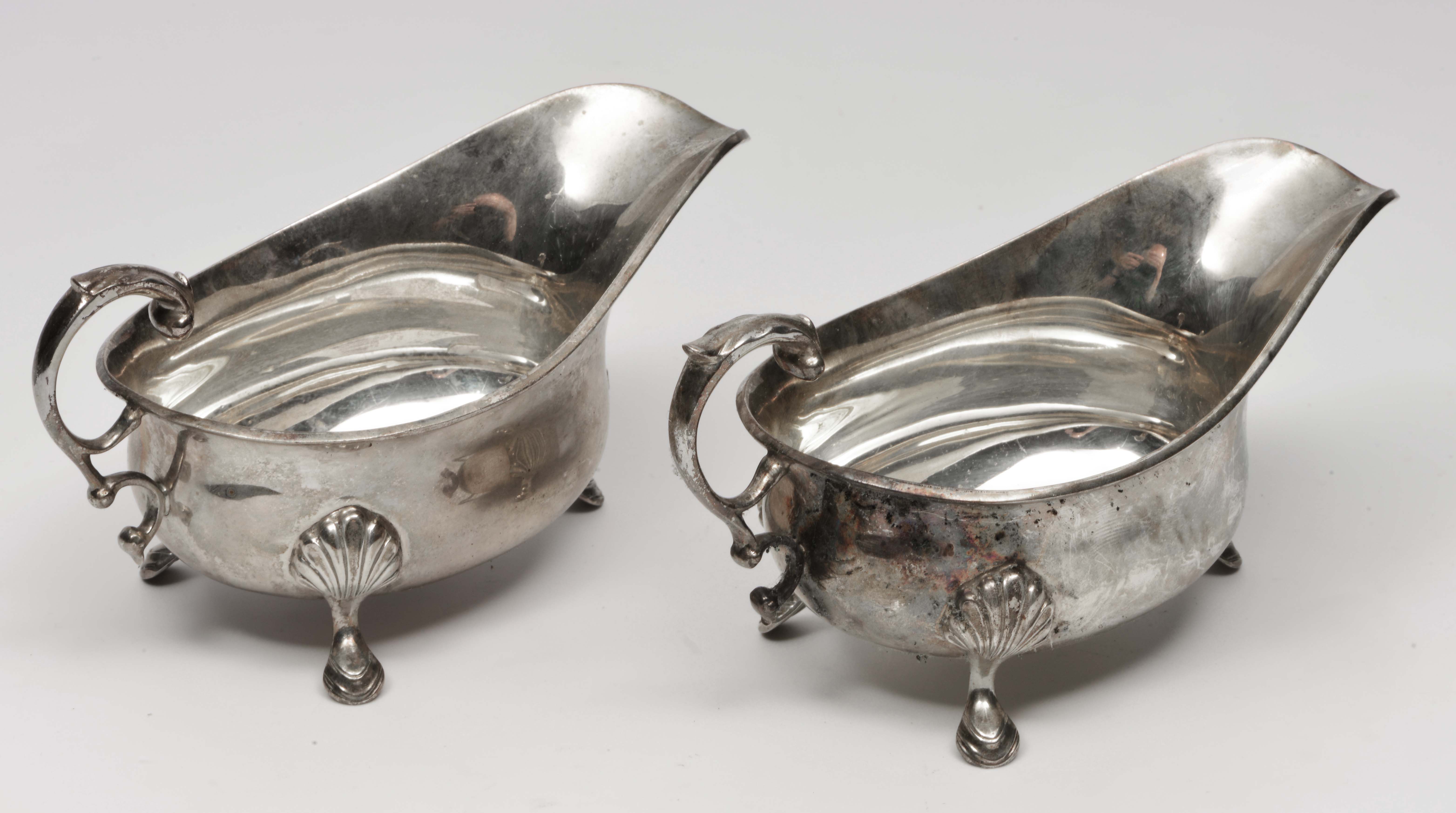 A PAIR OF SILVER SAUCE BOATS marks for London 1938, both 16cm in length (2)