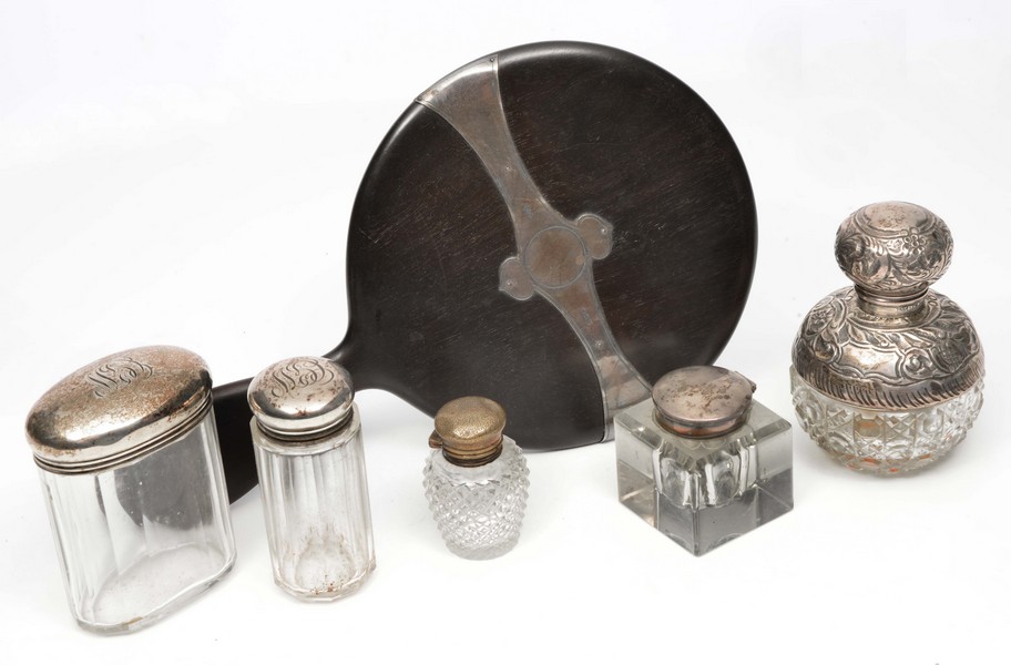 A VICTORINA SILVER MOUNTED PERFUME BOTTLE and two further silver topped glass bottles, a silver