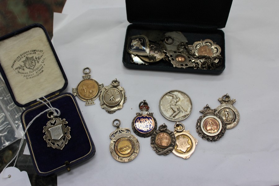 A GROUP OF SILVER SPORTING MEDALS