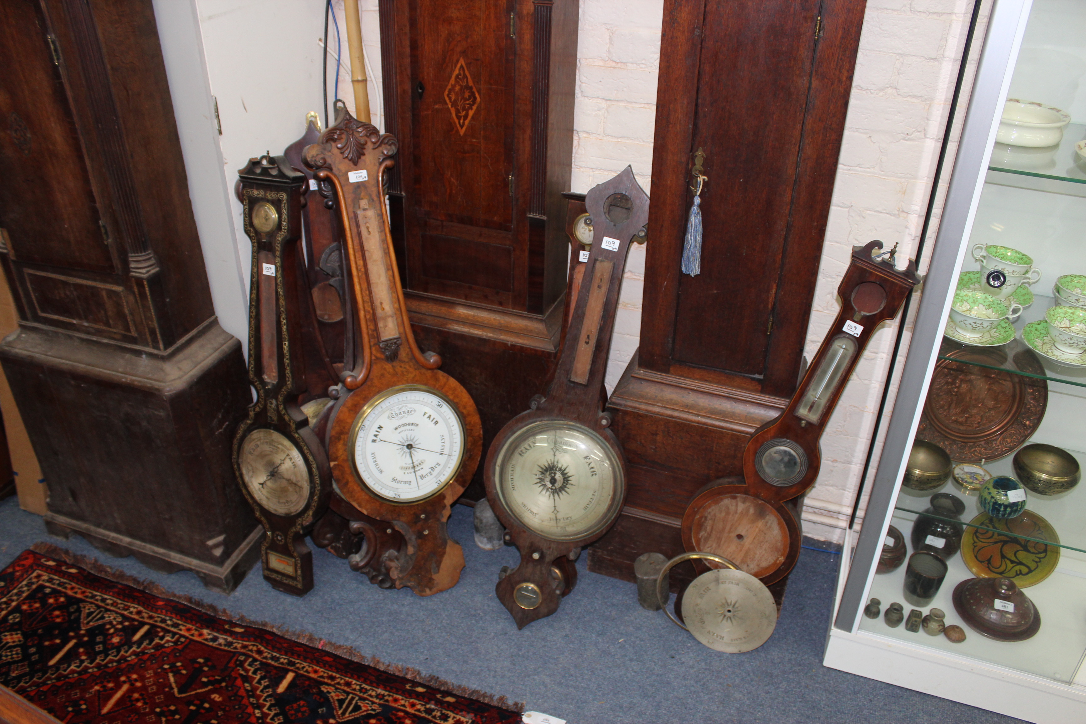 EIGHT VARIOUS 19TH CENTURY WHEEL BAROMETERS and a carved oak aneroid example for spares or repair