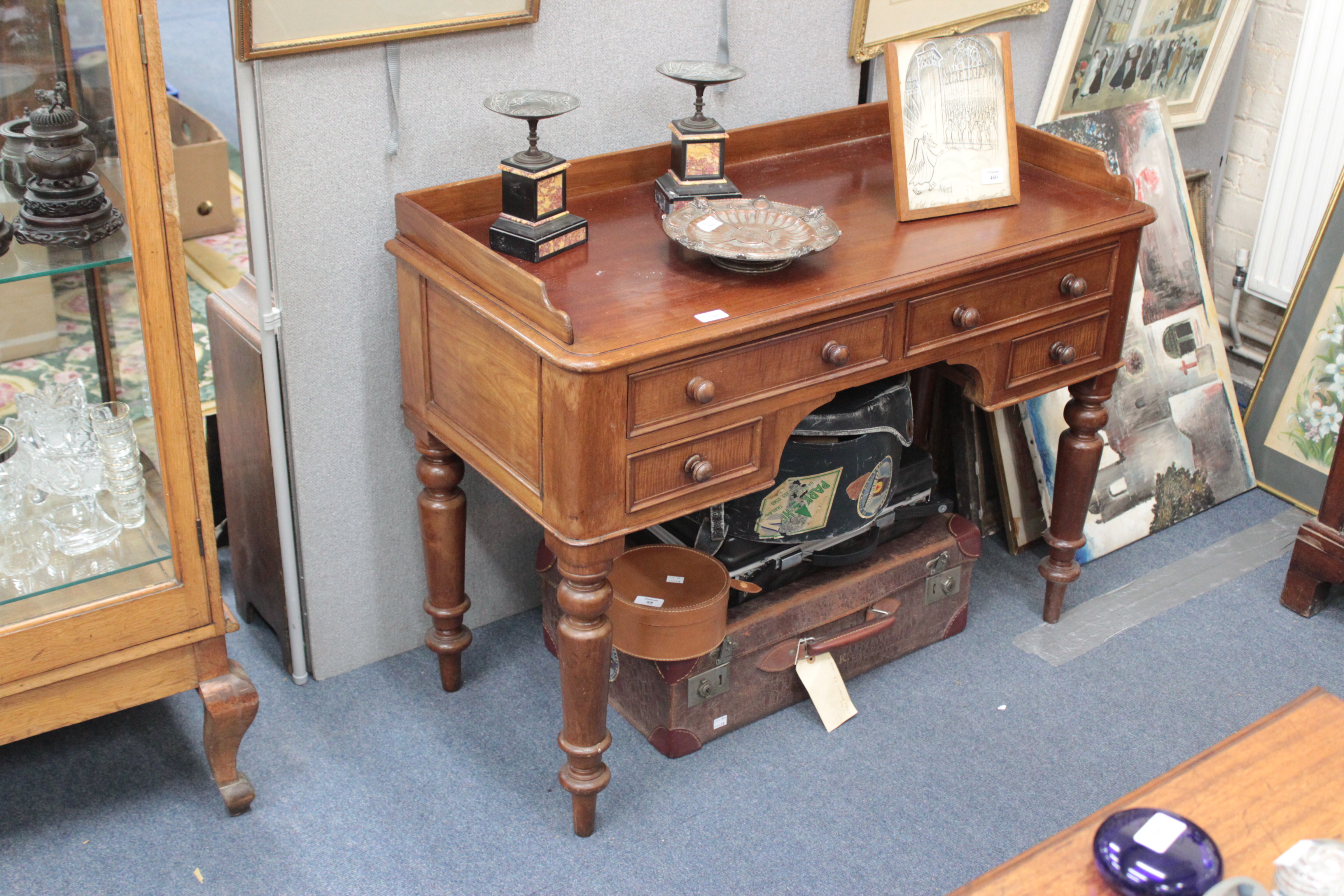 A VICTORIAN MAHOGANY DRESSING TABLE the galleried top over two longer drawers and two further short